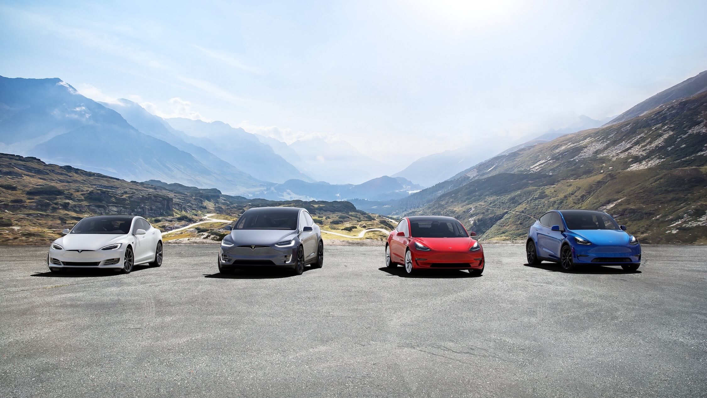 Tesla Model Y naast andere Tesla wagens